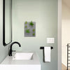 Gray modern sculptural green wall with air plants in a Modern bathroom setting.